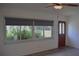 Bright living room with new floors, large window, and front door at 1665 Grove St, Clearwater, FL 33755