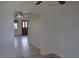 Bright living room with wood floors offers views to front door and hallway at 1665 Grove St, Clearwater, FL 33755