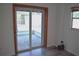 The sunroom features a sliding door, screen and tiled patio at 1665 Grove St, Clearwater, FL 33755