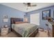 Colorful bedroom with a bed, shark-themed decor, and ceiling fan at 1720 Fruitridge St, Brandon, FL 33510
