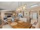 Open concept dining area featuring modern lighting and seamless flow to living spaces at 1720 Fruitridge St, Brandon, FL 33510