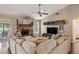 Cozy living room featuring a stone fireplace, plush seating, and an open layout at 1720 Fruitridge St, Brandon, FL 33510