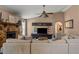Comfortable living room featuring a stone fireplace and neutral colored sectional sofa at 1720 Fruitridge St, Brandon, FL 33510