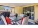 Enclosed patio features an outdoor dining table and seating, with a clear view of the yard at 1720 Fruitridge St, Brandon, FL 33510