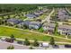 Aerial view of homes in a beautiful, well-planned community with lush greenery and scenic surroundings at 17589 Cruiser Bnd, Land O Lakes, FL 34638