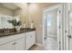Bathroom vanity featuring double sinks, granite countertops, and tile floors at 17589 Cruiser Bnd, Land O Lakes, FL 34638