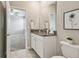 Charming bathroom featuring granite countertops, a vanity, and natural light at 17589 Cruiser Bnd, Land O Lakes, FL 34638