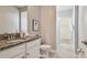 Stylish bathroom features granite countertops, a vanity, and a walk-in shower at 17589 Cruiser Bnd, Land O Lakes, FL 34638