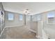 Spacious bonus room with neutral carpet, lots of windows, and bright natural light at 17589 Cruiser Bnd, Land O Lakes, FL 34638