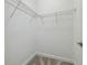 Walk-in closet features wire shelving and carpet flooring at 17589 Cruiser Bnd, Land O Lakes, FL 34638
