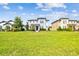 Two story home on a manicured lawn surrounded by green grass under a sunny sky at 17589 Cruiser Bnd, Land O Lakes, FL 34638