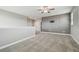 Open loft featuring a stylish accent wall, plush carpeting, and view of hallway at 17589 Cruiser Bnd, Land O Lakes, FL 34638