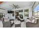 Covered patio boasts comfortable seating, a ceiling fan, and pool access at 17589 Cruiser Bnd, Land O Lakes, FL 34638