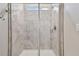 Tiled shower with glass door and window at 17589 Cruiser Bnd, Land O Lakes, FL 34638