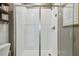 Modern shower with sleek glass doors, white tile, and contemporary fixtures for a clean, upscale look at 17589 Cruiser Bnd, Land O Lakes, FL 34638