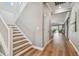 Bright entryway showcases a staircase with wood treads and white risers leading to the upper level at 17589 Cruiser Bnd, Land O Lakes, FL 34638