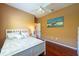 Relaxing bedroom with hardwood floors, a window, and ceiling fan at 18518 Bittern Ave, Lutz, FL 33558