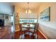 Cozy breakfast nook with ample natural light, stylish decor, and hardwood floors at 18518 Bittern Ave, Lutz, FL 33558