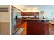 Spacious kitchen features stainless steel appliances, wood cabinets, and a large island at 18518 Bittern Ave, Lutz, FL 33558