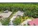 Beautiful aerial view of a home featuring a screened pool at 1877 Muirfield Way, Oldsmar, FL 34677