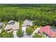 Gorgeous aerial view of a home surrounded by a vibrant green canopy at 1877 Muirfield Way, Oldsmar, FL 34677