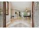 Inviting foyer with elegant flooring and access to the game room at 1877 Muirfield Way, Oldsmar, FL 34677