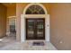Attractive front entry featuring decorative sidelights and double doors at 1877 Muirfield Way, Oldsmar, FL 34677