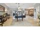 Spacious game room featuring a pool table, travertine floors, and ample seating at 1877 Muirfield Way, Oldsmar, FL 34677