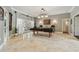 Entertaining game room with a pool table and French doors to outdoor patio at 1877 Muirfield Way, Oldsmar, FL 34677