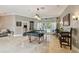 Bright game room with pool table, travertine floors, and access to the backyard at 1877 Muirfield Way, Oldsmar, FL 34677
