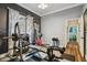 Home gym featuring a weight rack, free weights, and plenty of space for a complete workout at 1877 Muirfield Way, Oldsmar, FL 34677