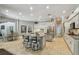 Spacious open kitchen with a kitchen island, granite countertops, and stainless steel appliances at 1877 Muirfield Way, Oldsmar, FL 34677