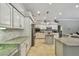 Spacious kitchen featuring granite countertops, stainless steel appliances, and ample storage at 1877 Muirfield Way, Oldsmar, FL 34677