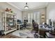 Dedicated home office space with multiple workstations and ample storage at 1877 Muirfield Way, Oldsmar, FL 34677