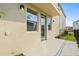 Exterior of the home features a back door with close proximity to yard at 2039 Amelia Bay Pl, Valrico, FL 33596