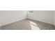Bright bedroom with plush carpet and ample natural light from a single window at 2039 Amelia Bay Pl, Valrico, FL 33596