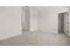 Spacious bedroom featuring neutral carpet, white walls, and a walk-in closet at 2039 Amelia Bay Pl, Valrico, FL 33596