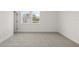 Bright bedroom with large windows overlooking a scenic view and plush carpeting at 2039 Amelia Bay Pl, Valrico, FL 33596