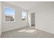Sun-lit bedroom with two windows and an open closet at 2039 Amelia Bay Pl, Valrico, FL 33596