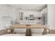 Spacious kitchen and dining area with white cabinetry, stainless appliances, and light-filled open layout at 2039 Amelia Bay Pl, Valrico, FL 33596
