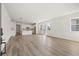 The bright, open-concept living area features wood-look floors and plenty of natural light at 2039 Amelia Bay Pl, Valrico, FL 33596