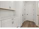 Mudroom area with white cabinets and quartz countertops at 2039 Amelia Bay Pl, Valrico, FL 33596
