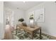 Bright office space with hardwood floors and a modern desk setup with stylish decor and natural light at 2039 Amelia Bay Pl, Valrico, FL 33596