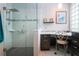 Bathroom view featuring the glass shower, seat, dual shower head and vanity area at 2121 Worthington Greens Dr, Sun City Center, FL 33573