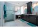 Gorgeous bathroom features a glass shower, dual sinks, dark wood cabinets and white tile at 2121 Worthington Greens Dr, Sun City Center, FL 33573