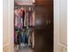 Walk-in closet with ample storage space and custom shelving, perfect for organization and convenience at 2121 Worthington Greens Dr, Sun City Center, FL 33573