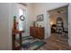 Inviting entryway featuring wood floors, a decorative front door, and a stylish accent cabinet at 2121 Worthington Greens Dr, Sun City Center, FL 33573