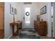 Bright foyer with decorative accents, stylish wooden furniture, and a patterned rug at 2121 Worthington Greens Dr, Sun City Center, FL 33573