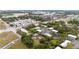 Expansive aerial view of a community with lush landscaping, multiple buildings, and convenient street access at 2174 62Nd N St, Clearwater, FL 33760