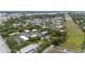 Aerial view showcasing an attractive community with various buildings, green spaces, and utility infrastructure at 2174 62Nd N St, Clearwater, FL 33760
